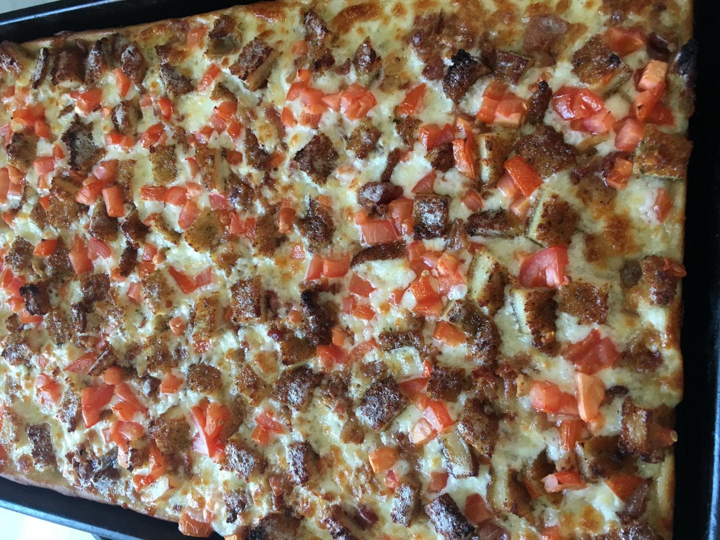 Freshly baked square pan pizza